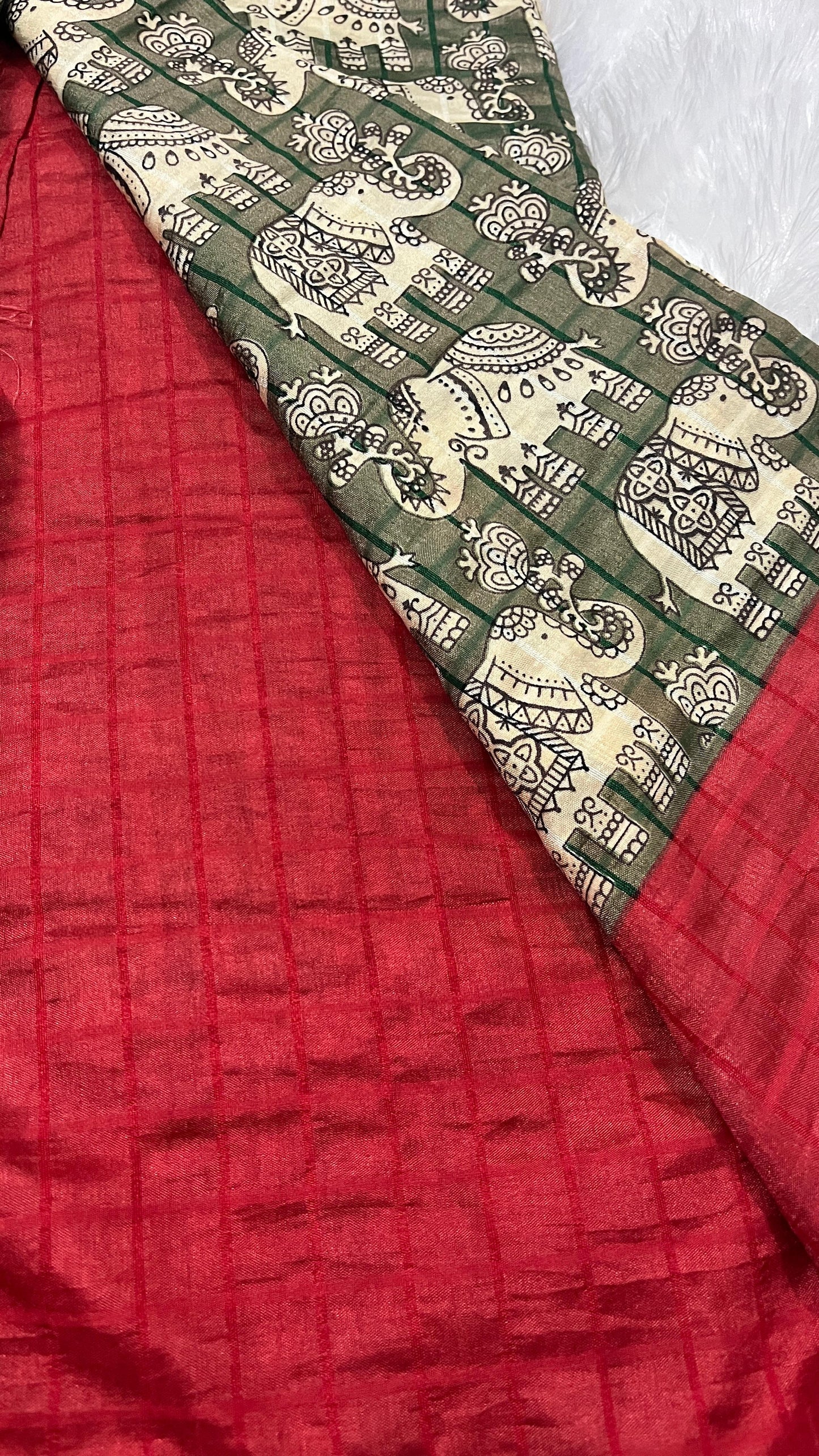 Hasthini – Green Elephant Print Soft Silk Saree with Red Border