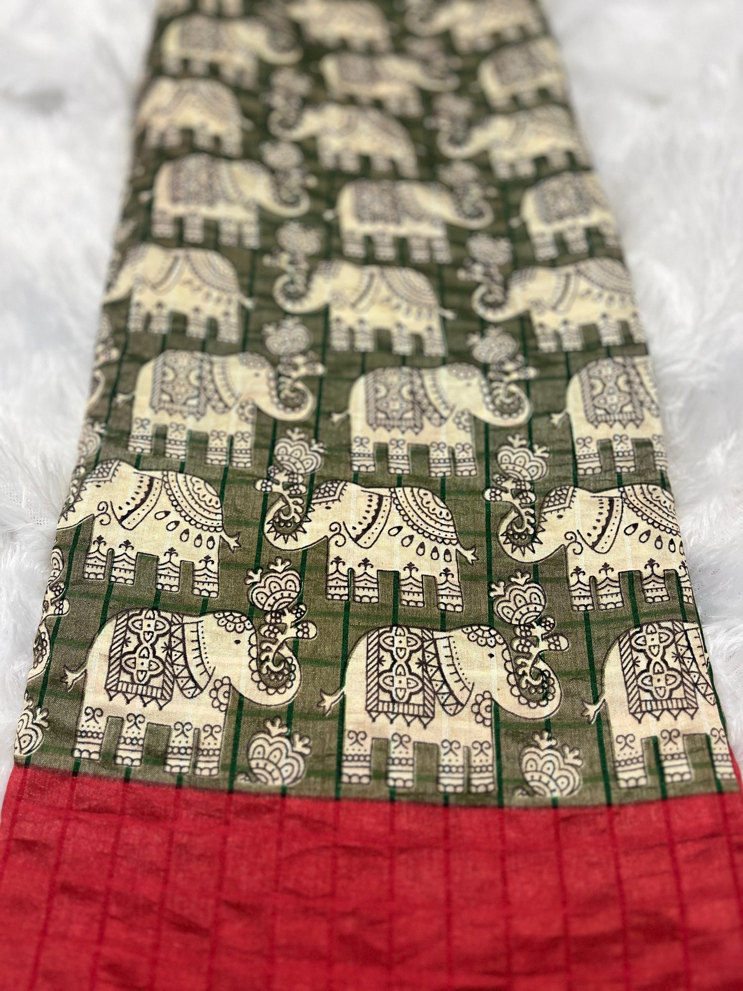 Hasthini – Green Elephant Print Soft Silk Saree with Red Border