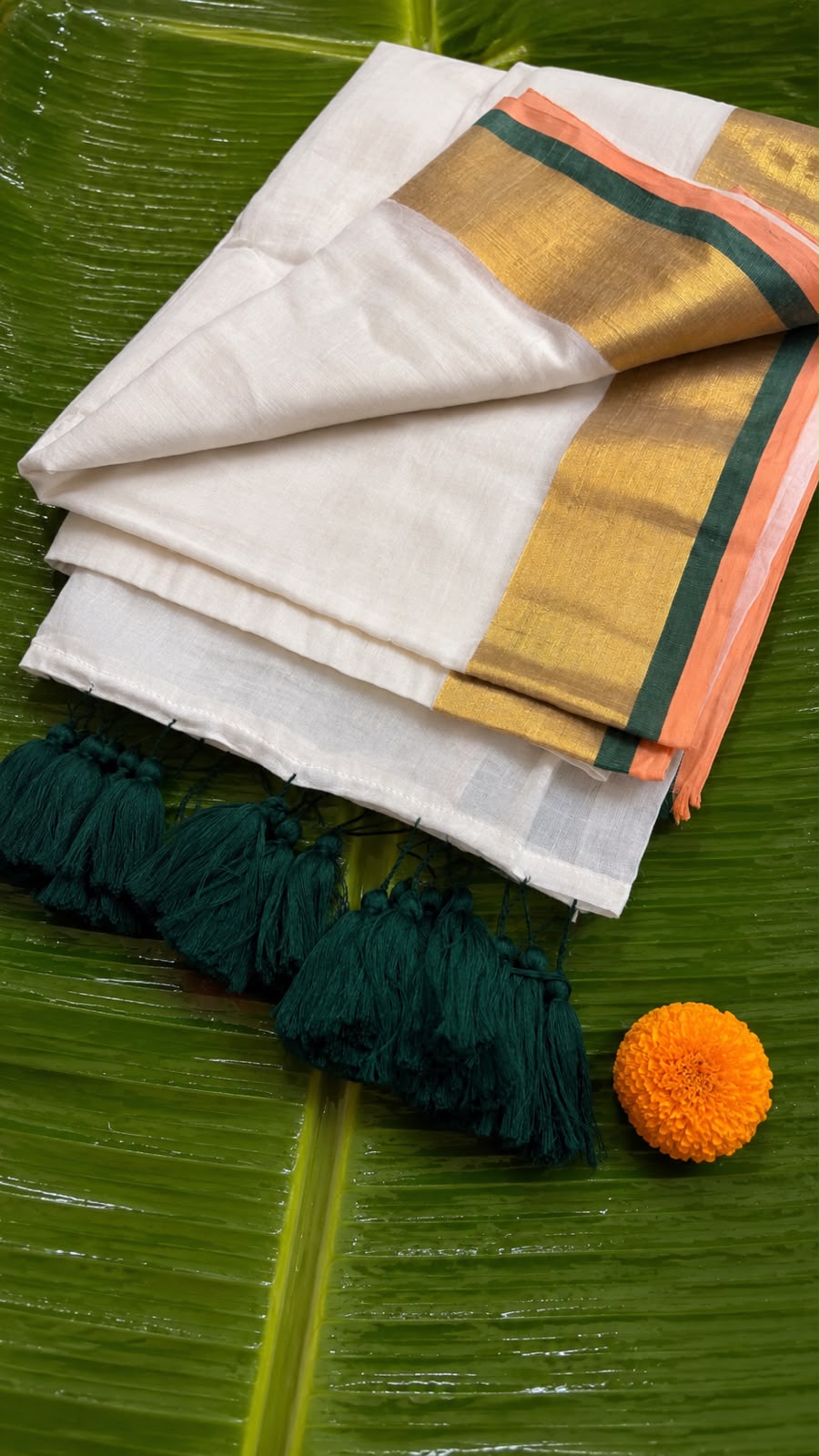 Poomkodi – Mul Cotton Saree with Peach, Green & Golden Kasavu Border
