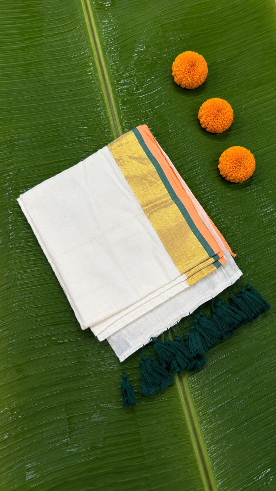 Poomkodi – Mul Cotton Saree with Peach, Green & Golden Kasavu Border