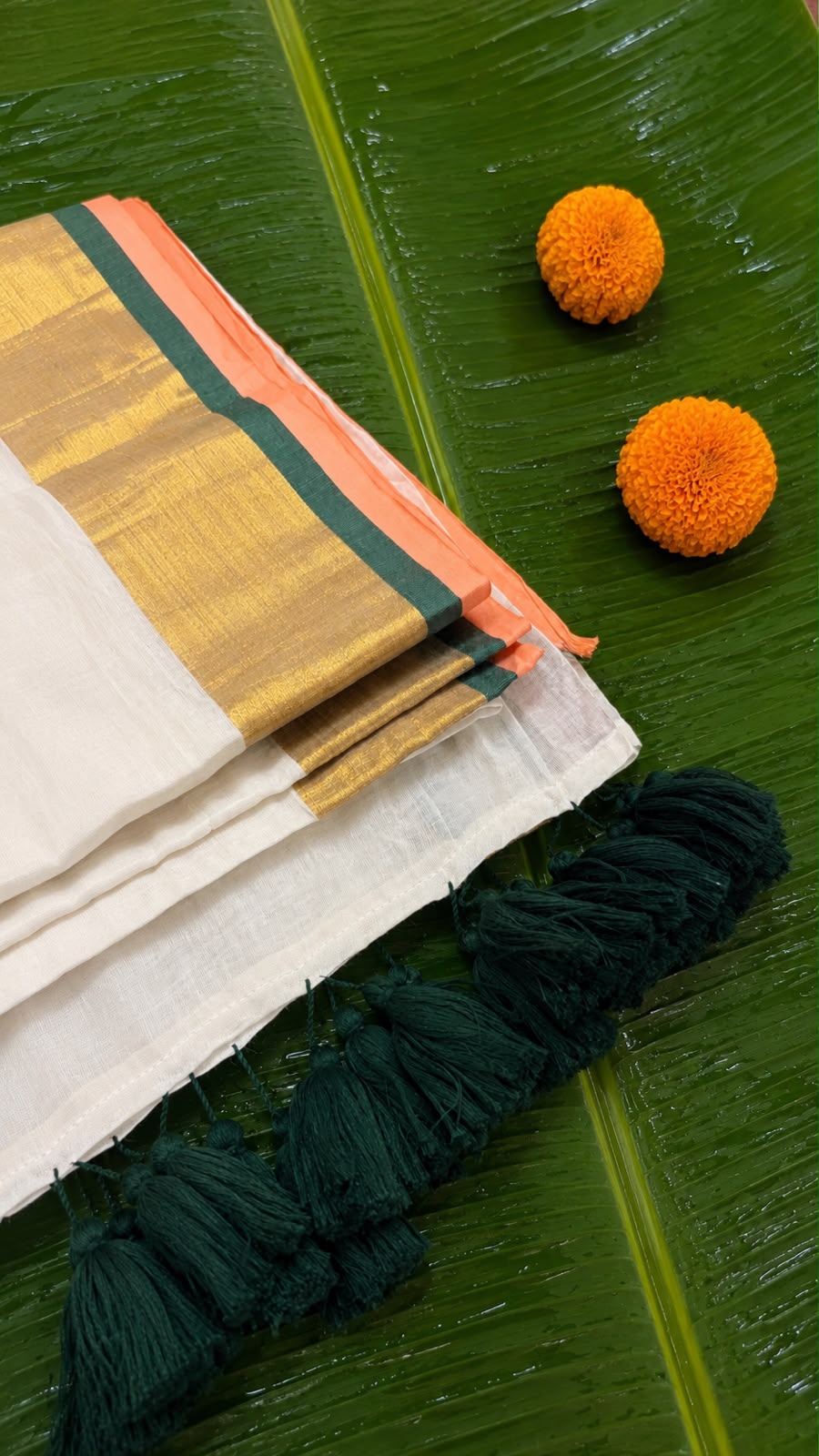 Poomkodi – Mul Cotton Saree with Peach, Green & Golden Kasavu Border