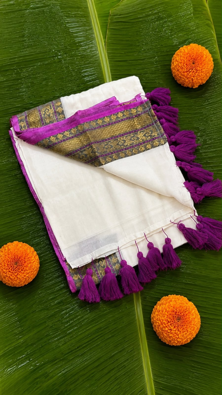 Shalabham – Off-White Mul Cotton Saree with Purple border and Tassels