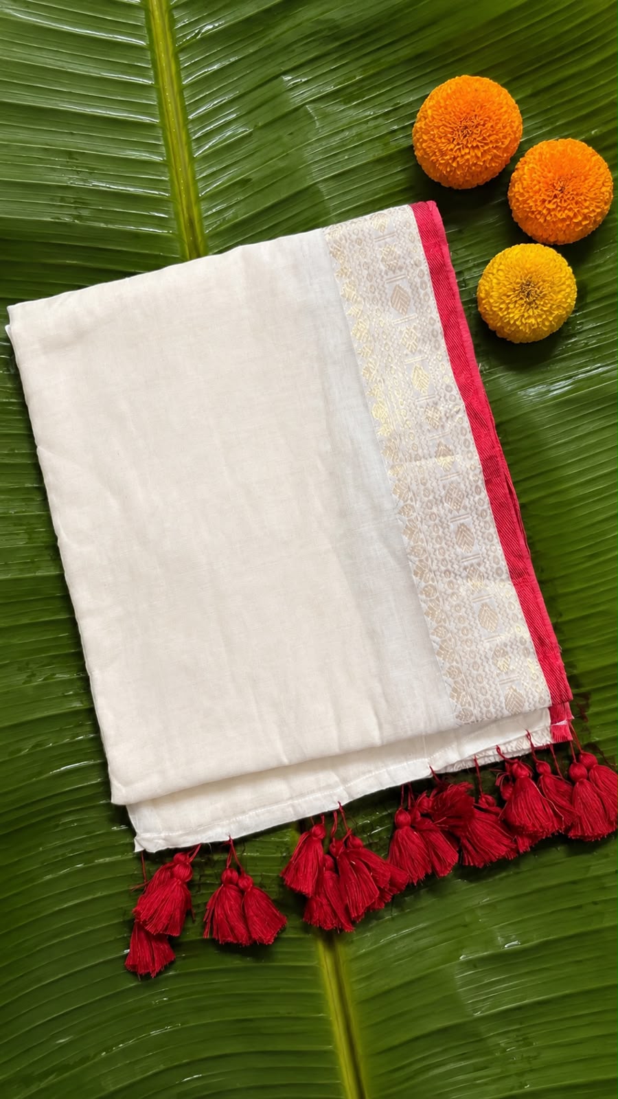 Anamika – Off-White Mul Cotton Saree with Rich Gold Zari Motif Border & Red Piping