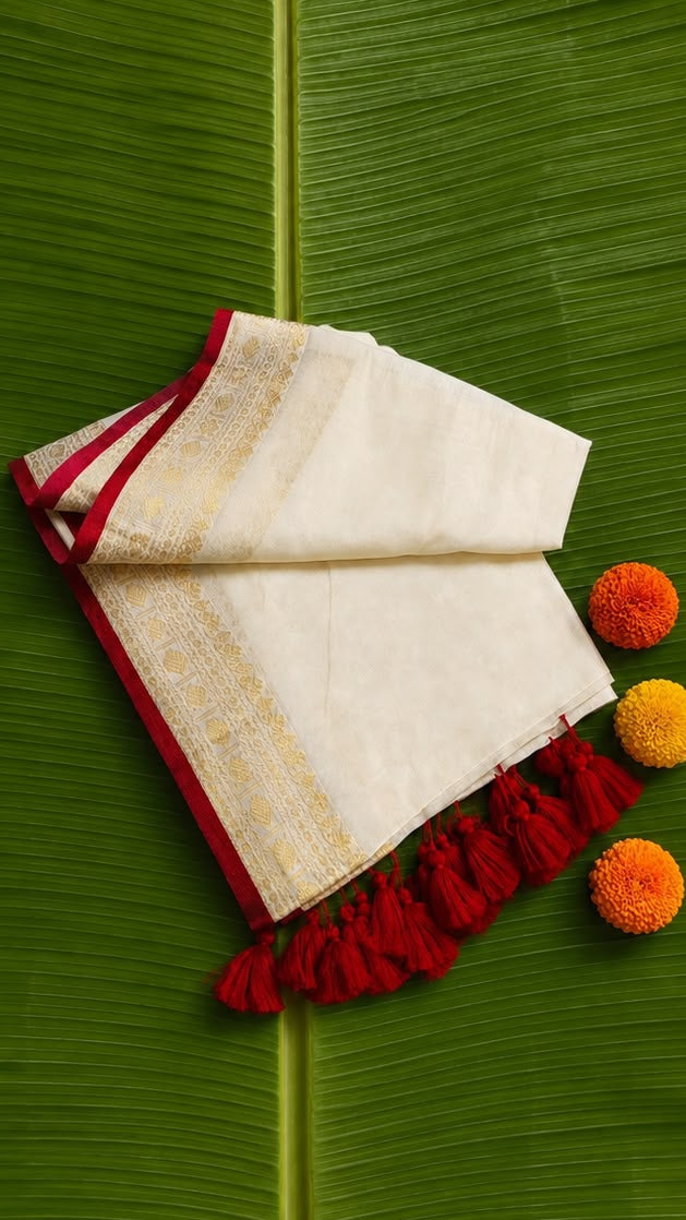 Anamika – Off-White Mul Cotton Saree with Rich Gold Zari Motif Border & Red Piping